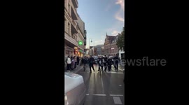 Germany: A pro-Palestine activist raises the victory sign while being arrested in Berlin