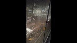 Woman Slips and Falls During Rainstorm