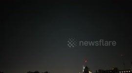 Starlink satellites over the skies of St James Park in Central London