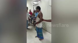 Snake bite victim carries reptile into hospital ward to show doctors