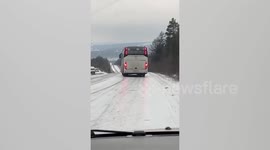 Russia: Bus Unable To Keep Straight On Icy Road Goes Down Slope Turning Almost Completely Sideways