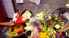 Fans pay tribute to Liam Payne at a phone box used in one of his music videos which is located at the Hard Rock Cafe in Piccadilly Circus