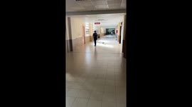 Clingy puppy follows school security guard