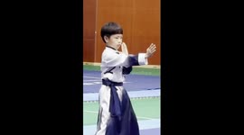 8-year-old boy practices Chinese Kung Fu