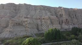 Ancient grottoes in China's Xinjiang attract tourists worldwide