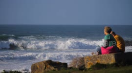 UK Weather, Storm Ashley hits Western Britain. Storm Spectators watching big waves location at Cribbar point, Fistral Bay, Newquay, Cornwall, UK