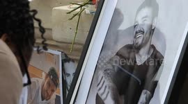 Fans pay tribute to Liam Payne in Paris by laying flowers and singing