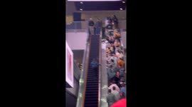 Girl Conquers Reverse Escalator Climb