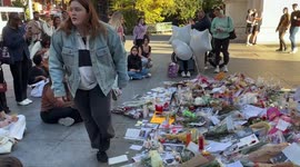 People gather at memorial for Liam Payne in New York’s Washington Square Park