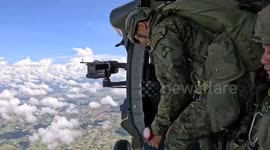Filipino soldiers jump from Black Hawk during free fall training