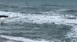 Swimmers brave Storm Ashley rough waves in Guernsey