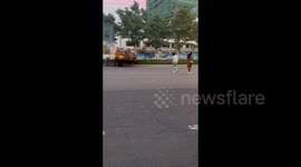 China: Two Ladies try to put out fire