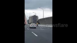 Man weaves through traffic riding electric scooter hands-free in China