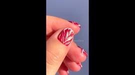 Short natural nails painted to look like raw meat with shiny dripping blood