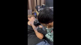 Little boy, 8, works on arm sleeve tattoos like a pro