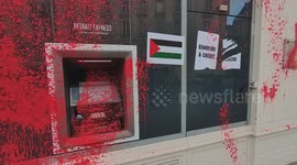 Pro-Palestine activists cover Paris bank in red paint