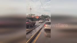 Cars battle through flash floods in Guatemala