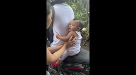 Clingy baby refuses to let uncle leave for work
