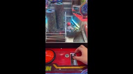 Woman wins at coin pusher game in Chinese arcade