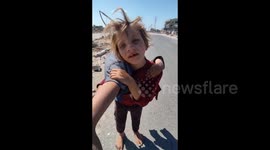 Palestinian girl, 8, carries little sister for more than 2km seeking medical attention in Gaza