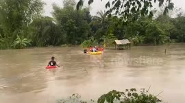 Residents rescued from Tropical Storm Trami flood on rubber raft