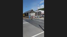 Crossing misuse at barmouth, woman almost gets trapped behind barriers while 158 dmu is ready to leave