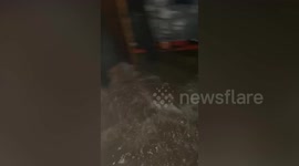 Tropical Storm Trami floods surge into homes in the Philippines