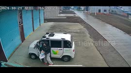 Mother knocked over by electric tricycle after child accidentally hits throttle while she opens garage door