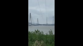 Electric workers conduct maintenance over Yangtze River