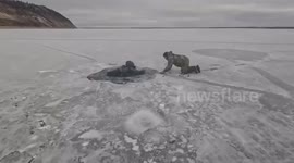 Russia: Brothers Risk Their Lives To Pull An Elderly Man Free From Frozen River