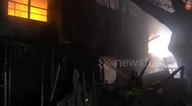US: House Burning Brightly In The Night As Firemen Battle To Contain It