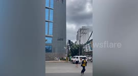 Tropical Storm Trami tears aluminium panels from building in the Philippines