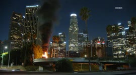 US, Los Angeles: Downtown Los Angeles Food Truck Burns Amidst Iconic LA Skyline View