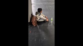 Evacuated passengers wait in conference halls for updates after 'suspicious vehicle' sparks panic at Birmingham Airport