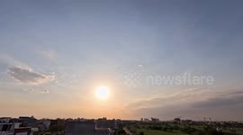 Time lapse of city sunset moving clouds fast moving traffic