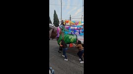 Bull Parade Float Knocks Distracted Guy Down