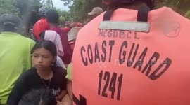 Coast Guards rescue families stranded in Tropical Storm Trami flood