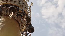 Large python coils on top of Buddhist pagoda in Myanmar
