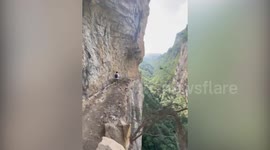Would you dare to walk along this narrow cliff path with steep drop?