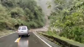 Flash flood surges down mountain during Tropical Storm Trami in the Philippines