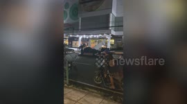Metal sheets fly off mall entrance canopy during Tropical Storm Trami