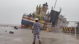 Loose 'dead ferry' crashes into port amid Tropical Storm Trami waves