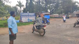 Polluted water flows out of a dam in south india, 10 feet height foam blocks road traffic