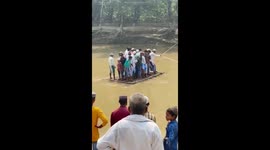 Raft carrying 20 locals across river capsizes
