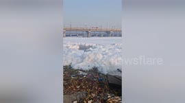 Toxic foam floats along  Yamuna River in Delhi, India