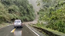 Tropical Storm Trami landslide crashes onto road in the Philippines