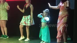 4 year old little girl belly dancing on Turkish Holiday