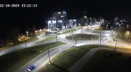 Van flips onto side after car crashes into it on roundabout