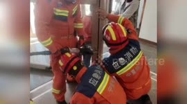 Chinese firemen rescue boy with foot stuck in revolving hotel door