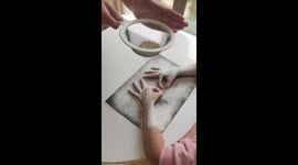 Mother and daughter have fun making flour art